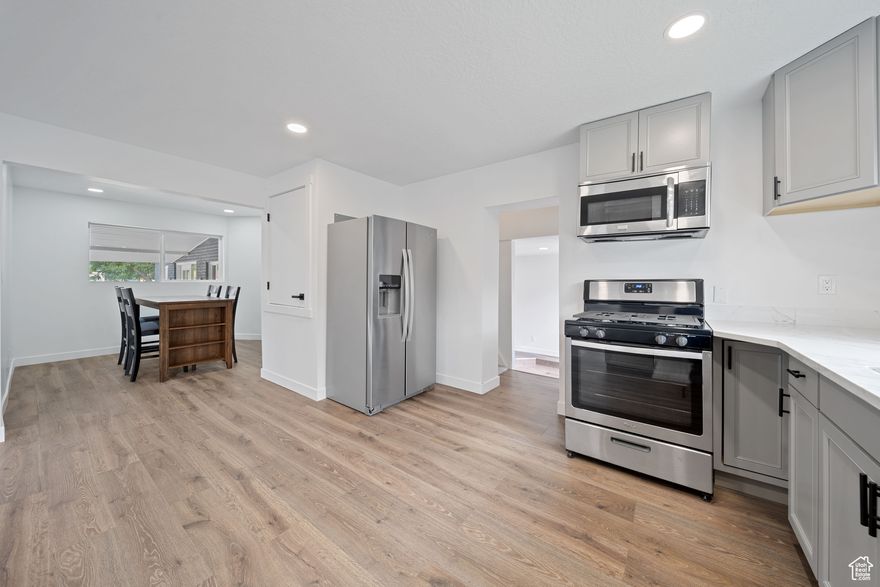 HUGE PRICE REDUCTION! Don't wait any longer, come see this beauty! Beautifully Upgraded 5-Bedroom Home with Income Potential. Welcome to this spacious and tastefully upgraded 5-bedroom, 3-bathroom home nestled in a prime location! With two full kitchens and a thoughtfully designed layout, this home offers flexibility, comfort, and functionality for modern living. Step inside and enjoy the natural flow of the open-concept living areas-perfect for relaxing, entertaining, or working from home. The fully fenced backyard with mature trees provides a peaceful retreat and a sense of privacy that's hard to find. Upgrades include a brand-new roof, modernized bathrooms, stylish new flooring, fresh interior paint, a new sprinkler system, and grass for easy maintenance and year-round curb appeal, as well as a brand-new driveway with ample parking space. The fully finished basement features a separate side entrance, making it ideal for a mother-in-law suite, guest quarters, or even a rental unit to generate additional income. Don't miss this rare opportunity to own a move-in-ready home with space, style, and options for the future!