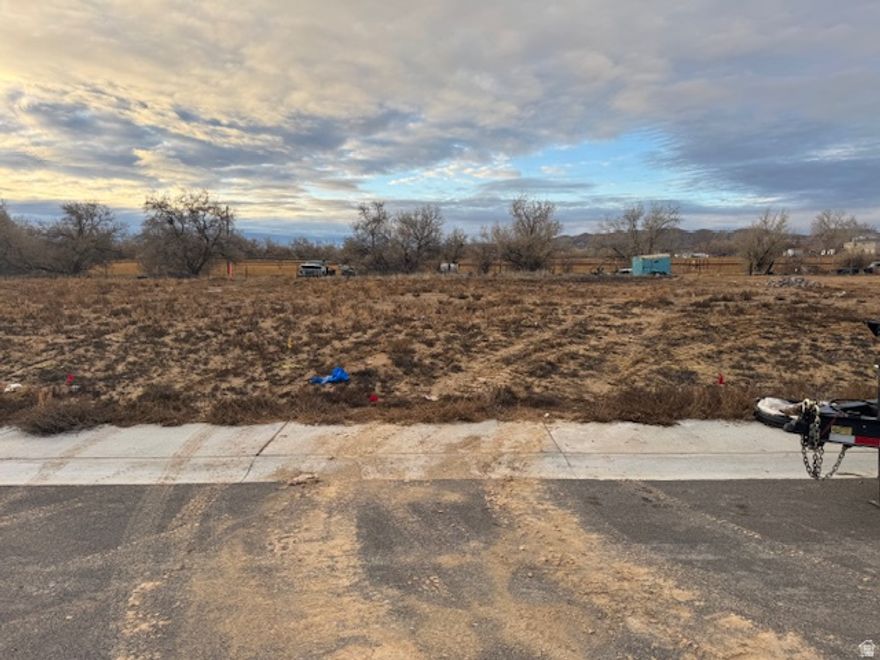 Lot 17 of Basin Acres Subdivision. Bring your own builder! There is an Ashley Valley Water connection allocated to the lot. Buyer will need to pay to connect water, sewer, gas, and power. New subdivision close to amenities. Information provided as a courtesy, buyer to verify all information.
