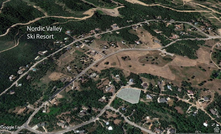 Build your dream mountain home on this wooded 1-acre lot just blocks from Nordic Valley Ski Resort and minutes from Powder Mountain, Snowbasin, North Fork, and all of the other great outdoor opportunities of beautiful Ogden Valley. Quiet and sloped, the homesite offers natural privacy and stunning views over Pole Creek to James Peak. Enjoy year-round beauty with mature trees, scrub oak, and a meadow of ferns. Perfect for a walk-out basement and deck with a hot tub to soak in mountain sunsets. In winter, live where you ski; in spring and fall, wake to songbirds and bubbling creeks. The site gets morning sun and features cool summer evenings.