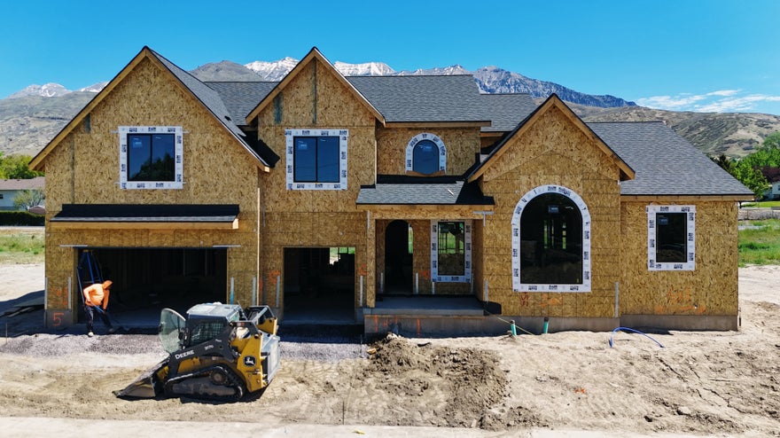 Discover a brand-new custom floorplan designed specifically for this exceptional lot in Orem. This stunning two-story home features a luxurious primary suite on the main level, blending comfort, convenience, and timeless style. Perfectly situated backing directly to the scenic Murdock Canal Trail, this home offers direct access to miles of walking and biking trails while nestled near the mountains with beautiful surroundings. Located minutes from the former WordPerfect campus, the location combines privacy and convenience.   Inside, you'll find expansive square footage loaded with designer-selected finishes and elevated details throughout. Spacious gathering areas, oversized bedrooms, and flexible living spaces create room for entertaining and everyday living. The basement includes a separate entrance with excellent potential for a future ADU, multigenerational living, or additional family space. A rare opportunity to own a designer home in one of Orem's most desirable locations. Scheduled to finish end of July.