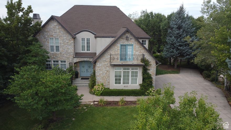 This striking updated two-story home offers a blend of modern design and functional living, perfect for a growing family. The floor plan creates a clear separation between the communal spaces on the main floor and the private bedrooms on the upper and lower level. Large windows flood the interior with natural light, highlighting the open-concept kitchen and living area. The upstairs master suite serves as a true sanctuary, complete with a luxurious en-suite bathroom and large walk-in closet. Enjoy breathtaking views of the mountains and valley. This large private yard features two ponds with a waterfall and garden area. The home maximizes its footprint while preserving ample yard space for outdoor enjoyment and enhanced curb appeal. Schedule your showing today!!