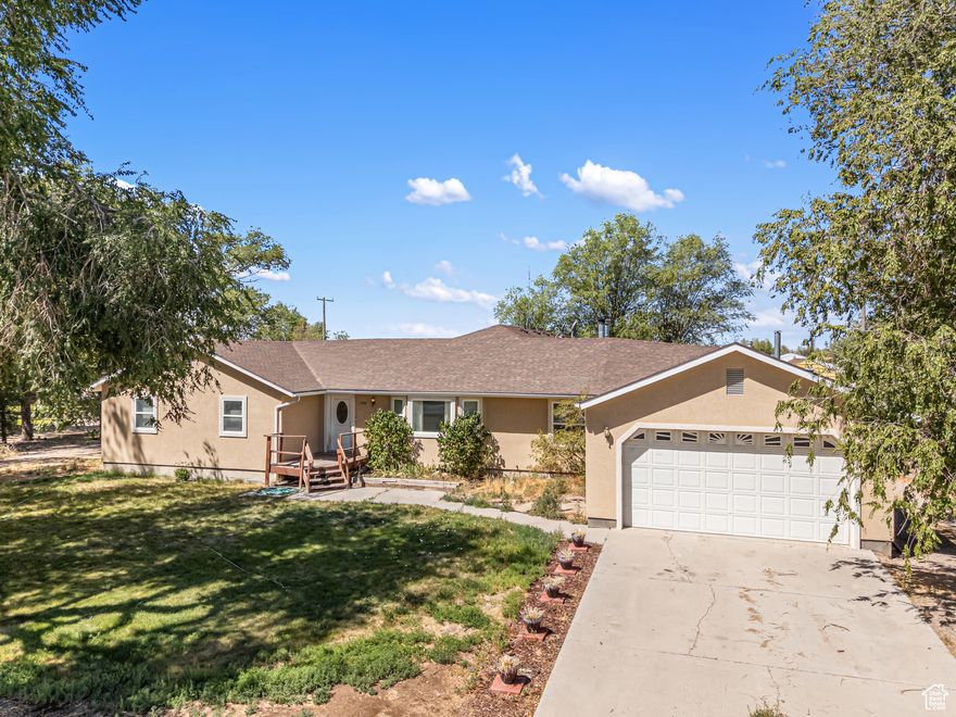 This spacious rural home sits on a large lot surrounded by open skies and desert views!  Designed for comfort & flexibility, the home features 2 Primary bedrooms-Perfect for multi-generational living or hosting guests in style. The walk-out basement offers endless potential, including space to create a basement apartment with its own private entrance. Whether you like enjoying private evenings in the shaded yard, or watching the sun dip below the horizon, this home offers the ideal blend of privacy, space and possibility.