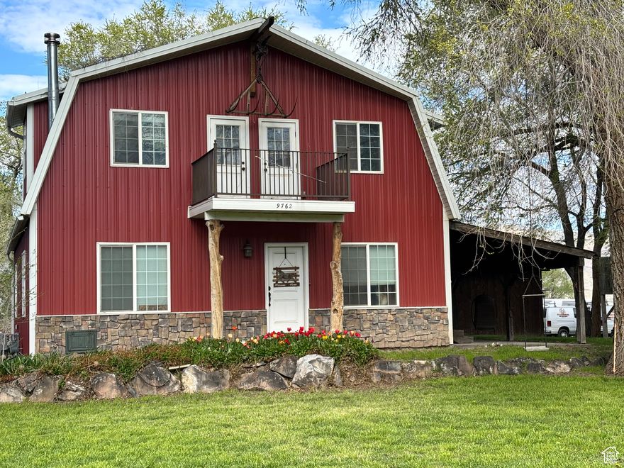 Price reduced. Investment opportunity - Zoned Agricultural or Industrial when you're ready to develop.  Well and irrigation water rights. The Red Barn is the most unique beautiful horse property in Utah County. This dream home has 6 bedrooms, 3.5 bathrooms, tons of storage, and was designed to be a beautiful home while being a turn key farm on 2.6 acres. The engineered hardwood floors are gorgeous and hardy. The kitchen is designed with functionality and style. The kitchen island bar has beautiful granite countertops. The master is on the main floor so this could be your forever home. The upstairs has three good-sized bedrooms and one of them is giant - it could be the playroom of your childhood dreams or a lucky teen could have a sitting area and bedroom. There is a double vanity bathroom upstairs. Downstairs there is another giant bedroom and a second bedroom that could be an office. There is also a full bath downstairs. There is a lovely family room with fireplace and two storage spaces one under the stairs and a full storage/ cold storage room. Enjoy the quiet under the covered patio or under the shade of mature trees. Have the best barbecues as you watch the kids climb the tree house.  Bring the kids, the dogs, the horses, chickens and even the neighbor kids and throw the best parties. In the back there is a hay shed, a tack shed, a workshop and a 1200 sq ft garage to hold all your toys and then some. The horses have a run-in paddock, an arena to play in and a pasture to be wild in. Come enjoy the perfect location of being in the country but also across the street from the city. Come see this dream home. Our loss is your gain we wish we didn't have to move.   460 sq ft covered patio with decorative Barn Plank-stamped and stained concrete, timber framing and metal roof. 1200 sq ft detached garage. Two 10 ft doors with openers. Rough sawn pine board and batten exterior with dark brown acid stain. Extra high ceiling height and metal roof.  600 sq ft concrete block workshop with workbench and storage.  240 sq ft hay shed with gapped pine siding for ventilation.  Custom tack shed with power is a corrugated steel silo conversion with wood veneer interior, built-in saddle racks, and 36" timber door.  Property was recently annexed into Payson City, with an updated address to 733 N 400 W Payson, UT 84651.   Agent related to Seller.