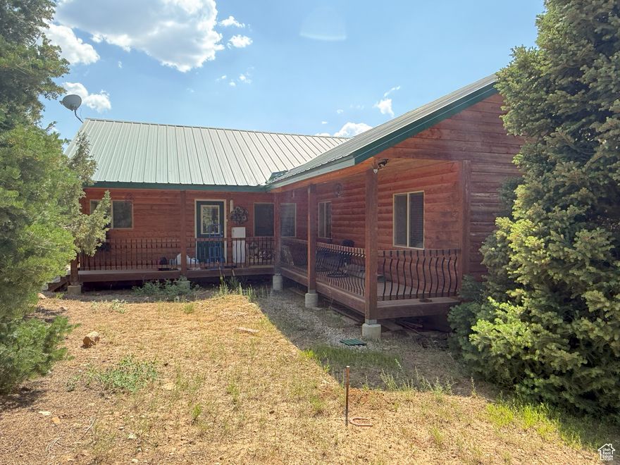 This mountain cabin/home has 3 bedrooms and 2.5 bathrooms on 1.1 acres and includes culinary water via the community water system, electricity from Rocky Mountain Power, and optional internet service. Take in breathtaking views from three spacious decks and the large windows throughout. The great room features vaulted ceilings, oversized windows with amazing views, and a cozy pellet stove. The owner's suite boasts vaulted ceilings and an ensuite bathroom featuring a separate shower, jetted tub, and dual sinks. While it's technically considered a crawl space because of its dirt floor, the crawl space area has an impressive 8-foot ceiling and measures approximately 50 by 13 feet. It also features a beautifully finished woodshop, ideal for projects and hobbies. The property is accessible by car during snow-free months, with winter access via snowmobile or tracked ATV. Conveniently located just over an hour from Provo and only 15 minutes from Mt. Pleasant, where you'll find all the small-town essentials-gas stations, restaurants, grocery and hardware stores, a hospital, and even a nostalgic drive-in theater. Outdoor enthusiasts will appreciate the nearby access to extensive ATV trails, as well as opportunities for fishing, hiking, biking, and hunting. The Pine Creek Ranch POA includes access to a 70-acre common area featuring campsites on the stream, pavilion, sand volleyball court, horse corrals, horseshoe throwing pit, and an area that can accommodate many RVs or trailers. The main parking area is plowed during winter months, although the roads themselves are not. Included in the amenities are water service, trash removal, and upkeep of the private roads and entry gates.  Square footage figures are provided as a courtesy estimate only and were obtained from the county records.  Buyer is advised to obtain an independent measurement.