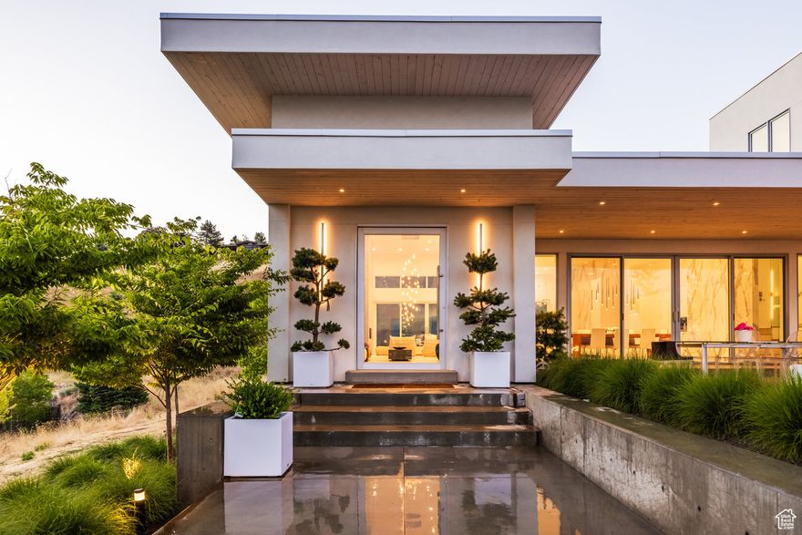 Incredible Contemporary home perched in the upper avenues with unobstructed views of the valley and mountains. Built in 2020, this home has all the modern high end conveniences including high end Poliform cabinets throughout the house, white ash 3/4 floors, Windsor commercial-grade windows and doors, and heated bathroom floors. The dramatic, formal entry with 15 ft ceilings opens into the expansive main floor living space with a beautiful kitchen with Miele appliances including a separate refrigerator and freezer, wine refrigerator, two dishwashers, and 16-foot island, a hidden butlers/working kitchen, ideal for entertaining, large living room with fireplace and two sitting areas, open dining area with sliding doors leading to a large outdoor patio with a gas firepit and incredible views of the valley and mountains. A large second primary bedroom with a large bathroom and two walk-in closets, a powder room, and laundry room complete the main floor. The upper level boasts the main primary suite with its own sitting area and fireplace, his and hers bathroom vanities and walk-in closets. The lower level has 12-foot ceilings and consists of a theater/family room with a fireplace, wet bar with a refrigerator and ice maker, two additional bedrooms, a large bathroom and 1,000 square feet of storage space. If you're looking for a tranquil oasis in the city, this home will not disappoint! Minutes to the University of Utah and Primary Children's Hospital, several hiking and biking trails, and Downton Salt Lake City.