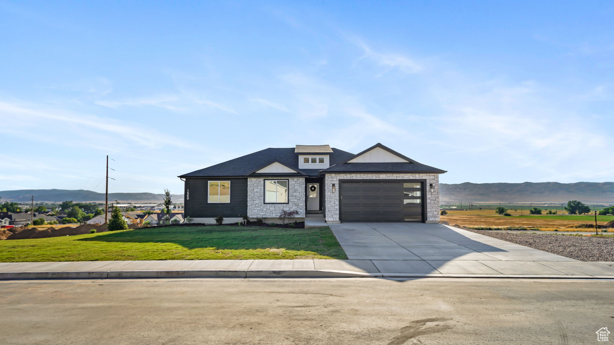 Beautiful CUSTOM Rambler built by Ridgeback Construction! Enjoy all the upgrades with affordability! Fireplace, quartz countertop, custom cabinets, lvp flooring, gas range, walk in closet, vaulted ceiling, and so much more! Walk out basement is already plumbed for a bathroom and kitchenette, perfect for a rental if needed. Enjoy quiet evenings and breathtaking views from the covered deck! Great location just minutes from I-15, schools, hospital, and city center. Front yard landscaping included! Call today for your private showing!