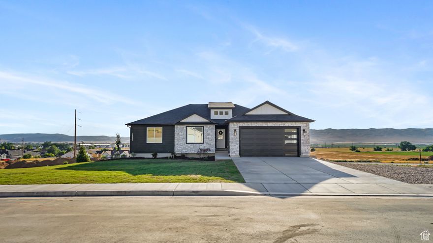 Beautiful CUSTOM Rambler built by Ridgeback Construction! Enjoy all the upgrades with affordability! Fireplace, quartz countertop, custom cabinets, lvp flooring, gas range, walk in closet, vaulted ceiling, and so much more! Walk out basement is already plumbed for a bathroom and kitchenette, perfect for a rental if needed. Enjoy quiet evenings and breathtaking views from the covered deck! Great location just minutes from I-15, schools, hospital, and city center. Front yard landscaping included!  Call today for your private showing!
