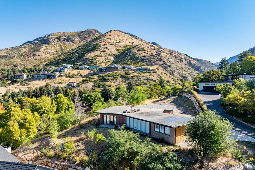 Rarely available building lot in prime location set at the North end of Olympus Cove. This building lot has great views looking up Millcreek Canyon and looks out over the Salt Lake Valley toward downtown. A small home currently sits on the property, but the real value is in the land and the opportunity to build. There truly isn't a better building lot along Salt Lake's east bench in our opinion. In addition to the views the setting is incredible with mature trees and tall pines frame the lot and create a sense of privacy and calm. The north end of Olympus Cove puts you at the mouth of Millcreek Canyon and the recreation that awaits as well as literally minutes to freeway with quick access to Park City, downtown, and nearby shopping and schools. It's a great spot to design and build your dream home in one of Salt Lake's most sought-after neighborhoods.