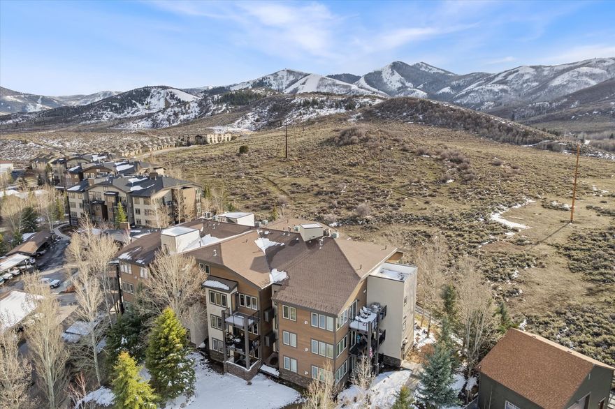 Welcome to this beautifully appointed 2 bedroom plus spacious loft, 2.5 bath penthouse in the sought after Crestview Condos of Park City. This 1,489 square foot top floor corner unit offers a bright, open layout with vaulted ceilings, abundant natural light, and a warm mountain feel throughout. The main level features an inviting open concept living area that flows easily into the kitchen and dining space, creating a comfortable setting for both everyday living and entertaining. The primary suite is also located on the main level, offering privacy and convenience along with a peaceful retreat at the end of the day. Upstairs, the generous loft provides flexible space for additional sleeping arrangements, a home office, or a cozy second living area. Whether used for guests or as a quiet workspace, it adds versatility to the home's layout. This condo also includes a dedicated parking space in the heated garage along with a large private storage room, ideal for skis, bikes, and all your mountain gear. HOA dues include access to premium amenities such as a pool, hot tub, clubhouse, snow removal, and trash service, making ownership easy and low maintenance. Conveniently located with quick access to world class skiing via a short drive or the free Park City bus, and within walking distance to many shops and restaurants, this property is perfectly suited as a full time residence, mountain getaway, or investment opportunity. Don't miss the chance to own in one of Park City's most convenient and desirable locations!