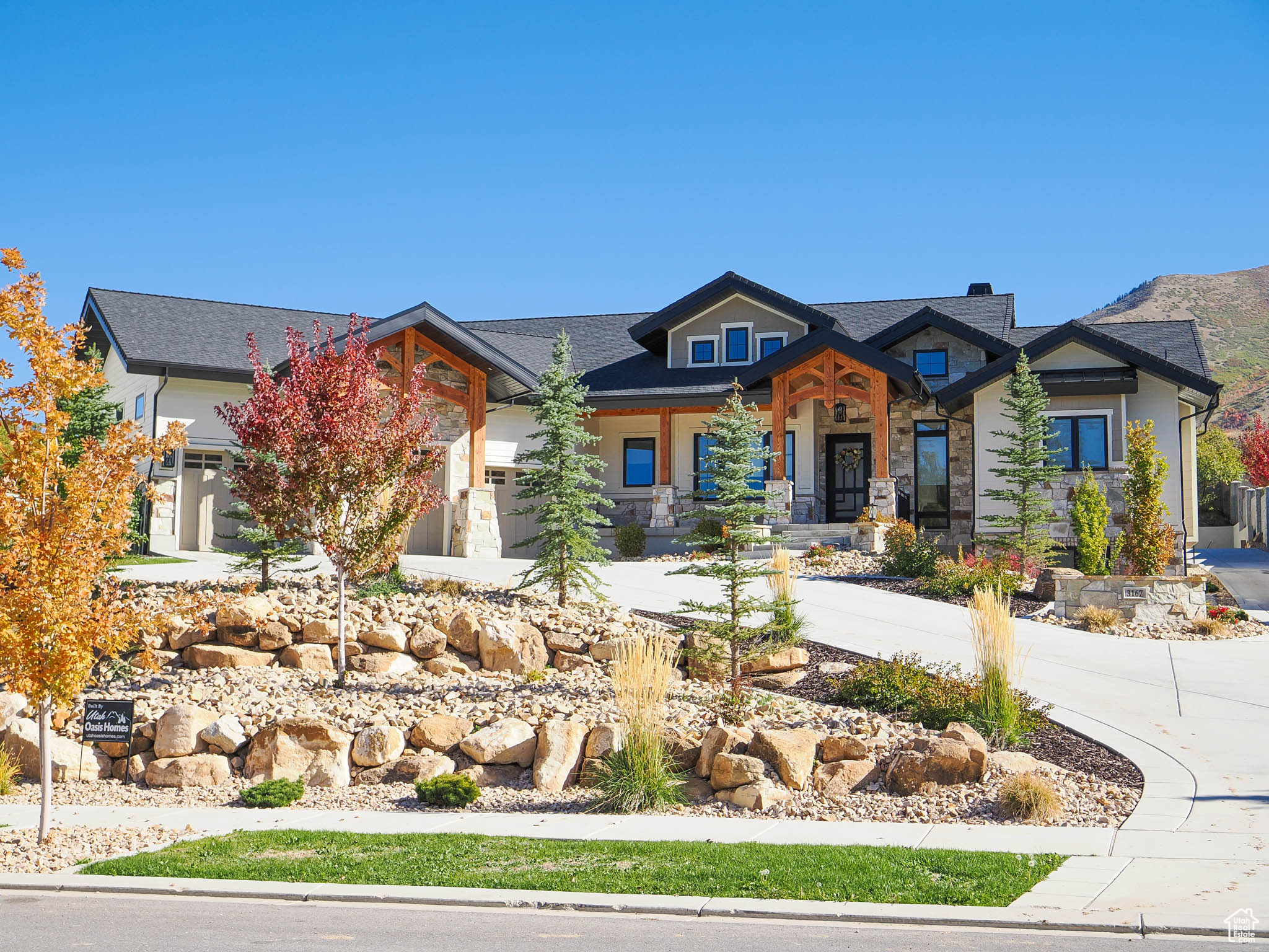 Stunning mountain modern rambler on .78 acre. Incredible neighborhood with amazing mountain views. Loaded with many upgrades-Open Theatre room, 10' basement ceilings, exposed exterior timbers, Sonos throughout, Andersen windows, heated garages, exercise room with dry sauna, 4 acres of open space directly across the street. Detached garage with mother-in law apartment. Just under 900 sq. ft of living area and 1166 sq. ft. of garage. 7 car garage total with house and detached garage. Landscaping includes in- ground trampoline, 2 fire pits, Olympus concrete fencing, Trim lighting, professionally landscaped with mature trees. Buyer to verify all info.