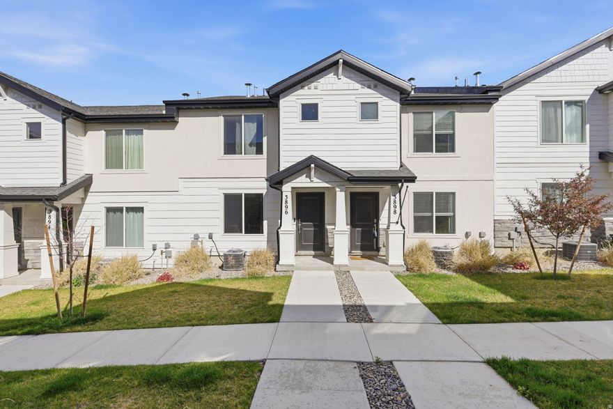 This is the one!  Best Priced unit tucked into a thriving community with sweeping views of the Oquirrh Mountains, this two-story townhome offers the perfect mix of comfort, style, and connection. Step inside to an inviting, large open layout where natural light pours in, creating a warm and versatile space for daily living. Built in 2023 this home is in like-new condition.   The HOA makes life easy, covering exterior maintenance, lawn care, snow removal, water, sewer, and garbage, plus incredible amenities like parks, clubhouse, pool, dog park, trails, and pickleball courts.