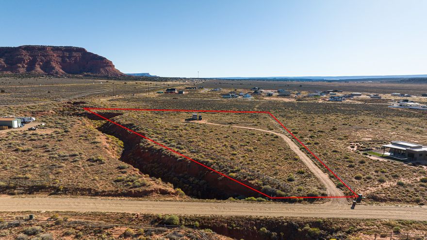 5 Acres with Sweeping Red Cliff Views- Almost fully fenced- STR-Friendly - Horse property. Already has a Driveway, septic, electric and water. Has had a previous RV site installed and is awaiting you to build a dream home. Experience the beauty of Southern Utah from this stunning 5-acre parcel showcasing unobstructed red cliff views and endless possibilities. The 1,500-gallon septic system is big enough to use for a home. This parcel allows two site-built homes. A single short-term rental is permitted on the property or a multi-generational home. A good option for those seeking income potential in a highly desirable area. Enjoy privacy, serenity, and the breathtaking natural scenery making this region so special - all while being minutes from town and outdoor adventure. Buyer to verify all.