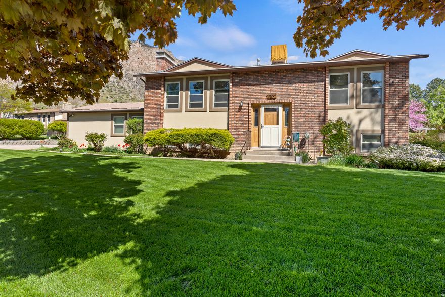 Immaculate home! Enjoy an updated, open kitchen, living and dining room, and walk out to the east-facing deck. Hardwood Floors upstairs. Beautiful mountain views! Master suite! Large laundry and storage. 2 Fireplaces. Attached two-car garage. Located very near schools, bus stops and parks. Minutes from hiking and biking trails. Beautiful, low maintenance yard. Take a look at the photos and schedule your tour of the property.