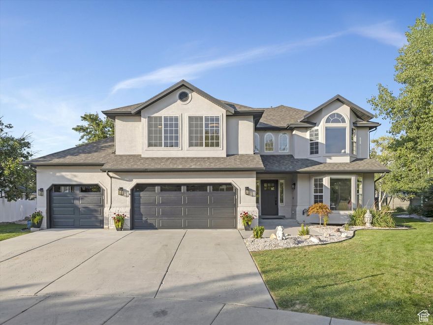 If "Location, Location, Location" are the three most important factors in a home, this Draper beauty has them all! Perfectly positioned at the end of a quiet cul-de-sac and within walking distance of Juan Diego Catholic High School, this fully remodeled two-story home offers style, convenience, and room to grow. Just minutes from Draper Landing shopping, top-rated restaurants, Cowabunga Bay, and the Living Planet Aquarium, everything you need is only five minutes away-leaving more time to enjoy your stunning home and its massive, lushly landscaped backyard. Inside, no detail has been overlooked. The main floor boasts a dramatic two-story family room with a floor-to-ceiling fireplace, a formal living room, and a dining space with a designer herringbone ceiling. The chef-inspired kitchen features two-tone custom cabinetry, a statement island with bar seating, and premium appliances, including a 36" gas range and Sharp drawer microwave. Upstairs, a grand primary suite stretches across the entire side of the home, offering a spa-like bath with a walk-in "water room" for tub and shower. Three additional bedrooms and a fun, ocean-themed bathroom designed with custom tile, lighting, and a built-in aquarium niche make this level unforgettable. The finished basement is a true entertainer's haven, complete with a massive media room, gym/dance studio, cold storage, and plenty of bonus spaces-including a bedroom currently set up as a music room. This home blends architectural creativity with practical living for maximum enjoyment and minimal effort. Come see why this Draper gem is the perfect place to call home! Buyer to verify all information.