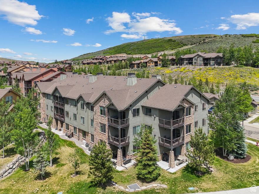 Welcome to one of the most desirable residences near Black Rock Mountain Resort-this beautifully finished main-level corner unit offers exceptional privacy, abundant natural light, and rare direct access via an attached garage-a standout feature in this area.  The bright, open floor plan includes rich hardwood flooring, granite countertops, custom built-ins, and plantation shutters, creating a timeless and functional living space. A private deck just off the main living area offers a peaceful place to relax and unwind, while the thoughtful layout makes this home ideal for entertaining or quiet weekend retreats.  Located just steps from the dining, bar, pool, and fitness center at Black Rock Mountain Resort, this home also offers unbeatable access to the best of the Wasatch Back. You're only 10 minutes to Park City Mountain Resort, 12 minutes to Historic Main Street, 15 minutes to Deer Valley Resort, and just 5 minutes from the future Deer Valley East Village, making this property a smart buy in a fast-growing, amenity-rich area.  Whether you're looking for a full-time residence, vacation home, or rental investment, this property checks all the boxes.