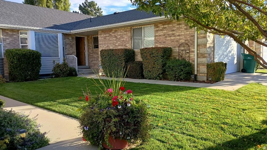 Luxury townhome living awaits! This four-bedroom plus office, two-and a half bathrooms, thirty one hundred plus square-foot home featuring large open floor plan and fully finished basement, sits on a private five acre estate with only twenty-six exclusive townhomes. Step inside to solid knotty pine floors, fresh carpets, new paint and crown moldings throughout. Fully furnished with high-end Lane and Aspen Home pieces, it's move-in ready. Enjoy shaker cabinets in the modern kitchen, a cool storage room, and an insulated garage. Extensive recent upgrades and a new roof in a home lightly lived-in located in a serene and secure neighborhood. The HOA maintains lush, mature landscaping and huge common areas. Perfectly secluded, yet just five minutes from Brigham Young University and Utah Valley University along with unlimited shopping nearby. Stunning mountain views make every day feel like a retreat. Don't wait-this gem won't last!