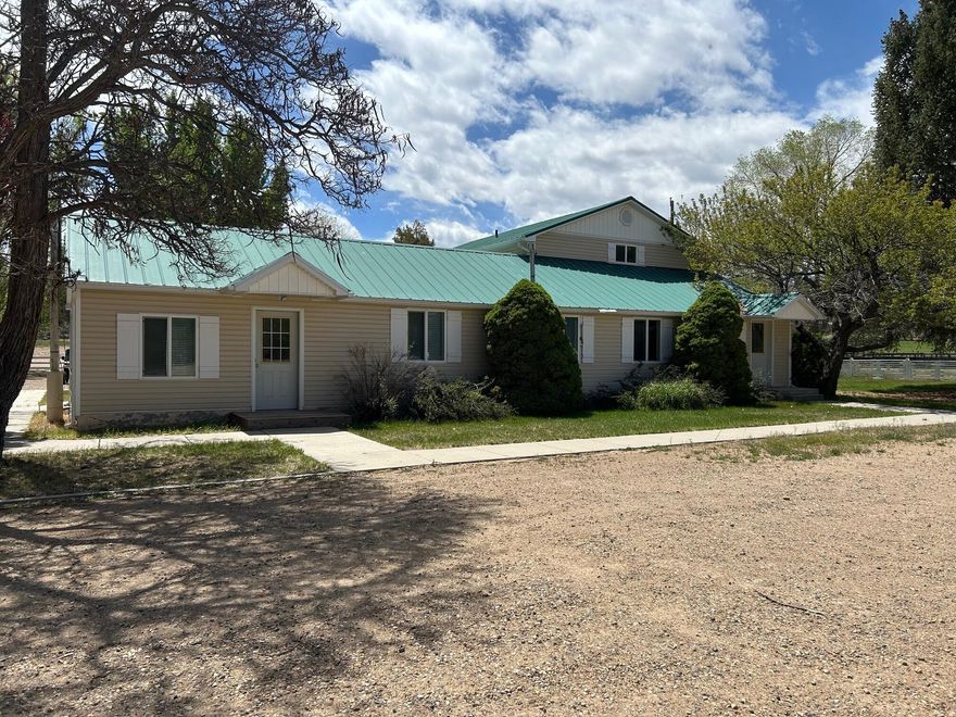 Perfect investment opportunity in scenic Escalante, Utah. Includes office building and metal storage building/warehouse with shipping door/truck ramp. Building has been used as an office building in the past. Many potential uses for the property with a large 1.44 acre lot in a great location.