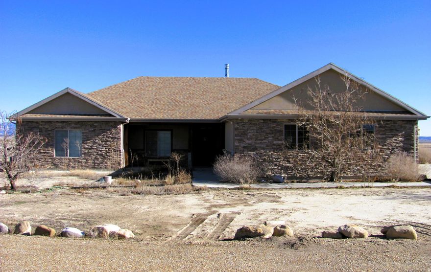 Escape to peace and privacy in this beautiful one-level, two-bedroom home nestled just outside of town. Set on a secluded property with breathtaking mountain views, this home offers the perfect blend of comfort, simplicity, and natural beauty.  Square footage figures are provided as a courtesy estimate only and were obtained from county records.  Buyer is advised to obtain an independent measurement.