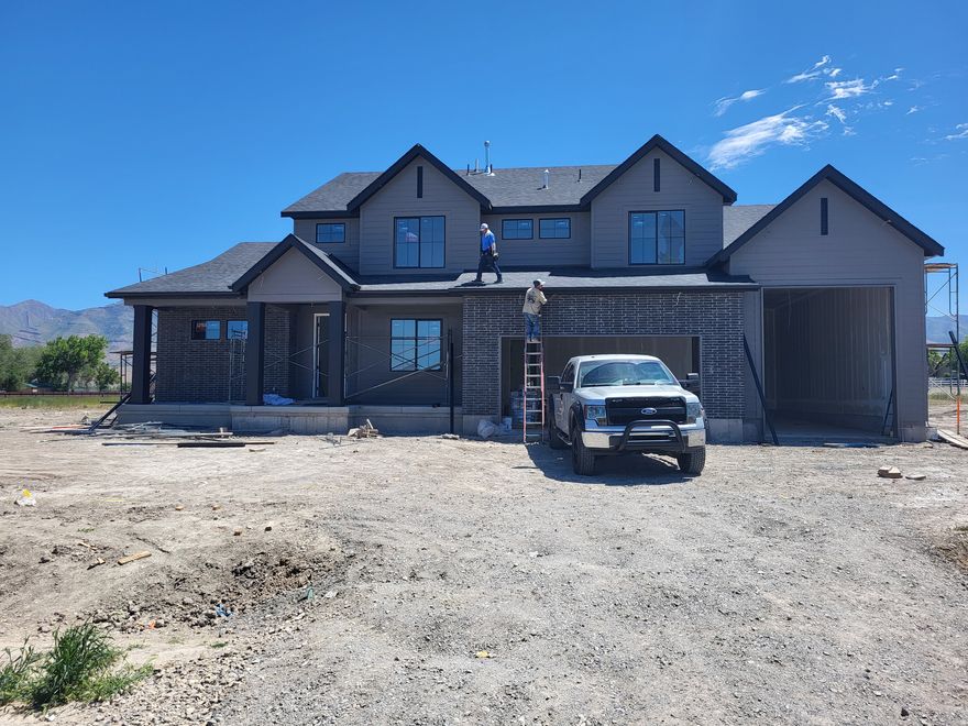 RILEY PARK IN ERDA 1 ACRE LOTS.  This home is under construction for a JUNE completion. Get up to $9000 in closing costs with our preferred lender.  This amazing ROCHESTER floorplan sits on 1 acre in Erda Utah. The main floor owner's suite has it all: tray ceiling, large walk-in closet with stackable laundry connection, double undercounter sinks, soaker tub and oversized shower. Get cozy in the large family room around the fireplace. The open concept kitchen includes a large island for food prep/counter seating, a large walk-in pantry, kitchen with gas cooktop, double ovens (not pictured in photos) 42" upper cabinets w/ crown molding, 30" Single sink, upgraded cabinet with dovetail, soft-close features. Laminate floor throughout the kitchen, dining, & family room. Quartz countertop in kitchen and bathrooms, Powder room located next to the garage entry and mud room bench. Stair railing with newel posts. Office with double doors.  Upstairs has a loft, 3 large bedrooms, full bathroom, and full laundry room. Home includes unfinished basement with 9' foundation walls, room for a large family room, 2 additional bedrooms, a bathroom, and under porch storage. 2 95% efficient furnaces, 50-gallon water heater, & plumbed for a soft-water system. 3-car RV garage with 12' x 10' door and extra space on the side of the garage to add an RV pad. Sitting on a 1-acre, this home has it all!  Ask me about our generous home warranties, active radon Mitigation System, and Smart Home Package, which is included in this home. The actual home may differ in color, material, and/or options. Picture of the outside is the exact home.  Other pictures are of a finished home of the same floorplan, and the available home may contain different options, upgrades, and exterior color and/or elevation style. Square footage figures are provided as a courtesy estimate only and were obtained from building plans. No representation or warranties are made regarding school districts and assignments; please conduct your own investigation regarding current/future school boundaries.