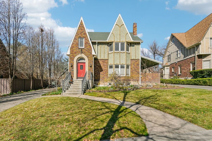 Located on one of the most desirable streets in Yalecrest, this Tudor-style home offers a rare opportunity in one of Salt Lake City's most established historic neighborhoods. The property has been owned by the same family for more than 30 years and blends classic character with extensive structural and mechanical upgrades rarely found in homes of this era. The home features original diamond leaded windows, 9' ceilings on the main level, a spacious living room with fireplace, formal dining room, and doors opening to a private covered patio. The basement was lowered approximately two feet, creating 8'4" ceilings and a more functional lower level. It includes tall wainscoting, wood trim, a coffered ceiling, a built-in projector screen, and a 7-channel audio system. A kitchenette and laundry with a gas line for cooking add flexibility, and the walk-out basement offers strong ADU potential. Major improvements include in-floor heating on the main level and basement, separate HVAC for the second floor and attic level, PEX supply plumbing, a renewed water main from the meter, French drain with sump pump around the foundation, an updated and relocated electrical panel, and a new roof installed in 2021.