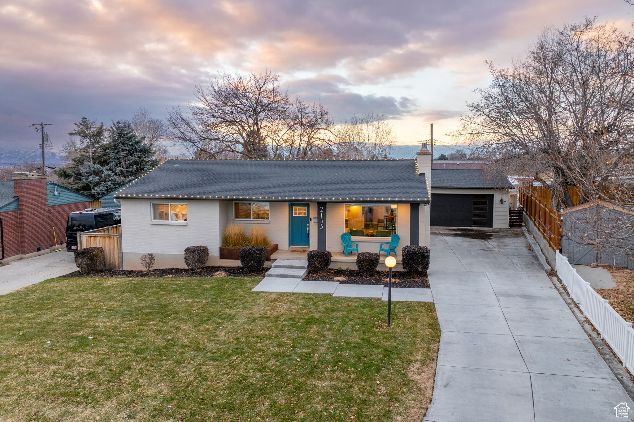 This bright and cheery 4-bed, 4-bath home has everything you've been looking for in a prime location! Thoughtful architecture mixed with impeccable design inside and out. Walking up to the brightly painted front door sets the tone, while large windows ensure plenty of light throughout. With built-in shelves in the living room, you can showcase all your treasures and enjoy a relaxing evening in.  The gorgeous high-end kitchen touts a massive countertop for bar-stool eating, designer lighting, stainless steel appliances, and easy access to indoor-outdoor living with large sliding glass doors that open up to a secluded patio - great for entertaining! You'll love the primary bedroom with its gold accents, walk-in closet, and ensuite bathroom, complete with a barn door for privacy. Double sinks and subway tile round out the look of the room, with complementary features found in the other bathrooms located throughout the home.   Head downstairs to find a fully finished basement, including a laundry room with a sink and plenty of counter space, and two additional bedrooms. A fireplace serves as the focal point, warming up the room for a cozier atmosphere. *try not to miss the hidden playroom under the stairs!   A detached garage with a newer door provides additional storage space and protection for your vehicles, it's even fully wired for your Tesla charger. The yard also boasts a spacious patio with mature trees and grass for year-round time outdoors.    The property's location is just minutes from I-215, as well as hiking and biking trails, ski areas, and other attractions. You can also enjoy dining and shopping nearby.