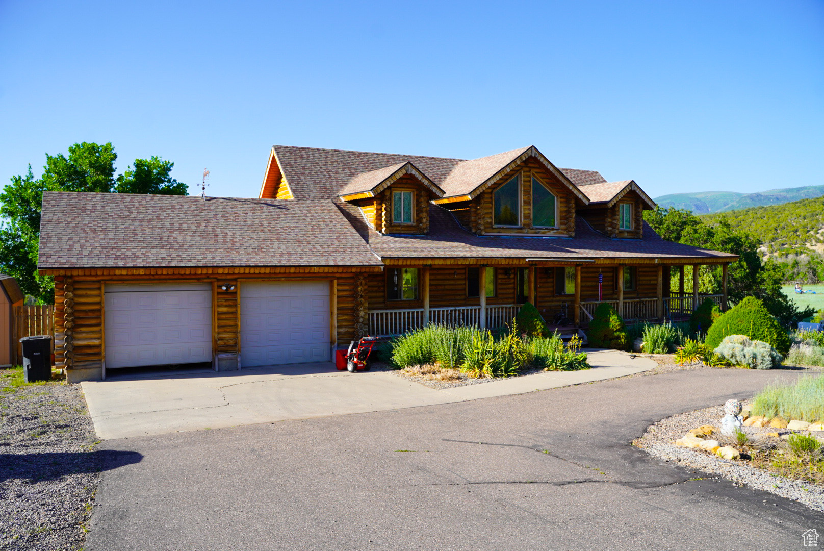 This stunning property featuring breathtaking views and a charming wrap-around porch that invites you to relax and enjoy the scenery. The spacious rooms offer comfort and versatility, complemented by cozy fireplaces in both family rooms that creates a warm ambiance. This home beautifully blends rustic charm with modern touches, providing the best of both worlds. Situated on just over 4 acres, it truly is a slice of heaven. Conveniently located just east of Mt. Pleasant, you'll enjoy peaceful living while remaining in close proximity to shopping and daily conveniences.