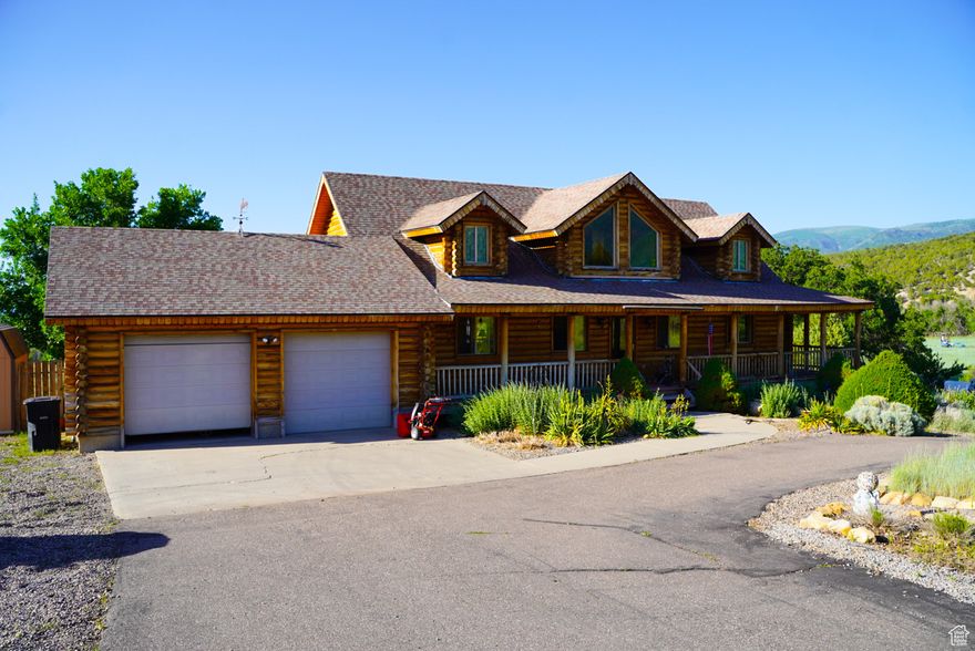 This stunning property featuring breathtaking views and a charming wrap-around porch that invites you to relax and enjoy the scenery. The spacious rooms offer comfort and versatility, complemented by  cozy fireplaces in both family rooms  that creates a warm ambiance. This home beautifully blends rustic charm with modern touches, providing the best of both worlds. Situated on just over 4 acres, it truly is a slice of heaven. Conveniently located just east of Mt. Pleasant, you'll enjoy peaceful living while remaining in close proximity to shopping and daily conveniences.