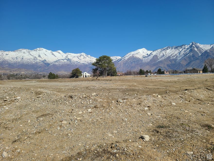 Your Dream Home Starts Here!  Welcome to this rare gem in Highland, Utah-a stunning estate lot with breathtaking mountain views, nestled in a quiet, exclusive neighborhood. This community boasts no HOAS and large animal rights, giving you the freedom to create the lifestyle you've always wanted.  Imagine waking up to majestic sunrises over the mountains, spending your days exploring world-class skiing, mountain biking, and hiking, and winding down with unbeatable sunsets right from your backyard.   Experience the best of both worlds-seclusion and serenity, yet conveniently close to top-rated schools, shopping, and dining.  Whether you're an outdoor enthusiast or simply crave peace and privacy, this is the perfect place to build your custom dream home.  A home built on this lot can face either south or east.
