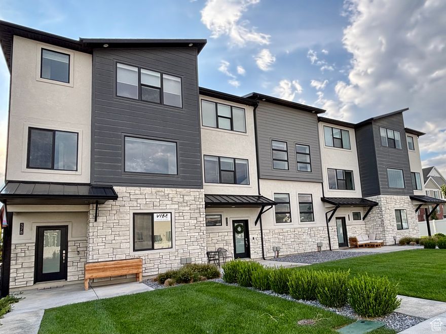 Buyers are being offered a 1/0 buydown by using the preferred lender! Stunning, turn-key townhome ideally situated near TRAX and shopping! Nestled on the community's outer edge, this home offers a spacious, open feel with easy access. It includes a large grassy area in front of the townhome and no immediate back neighbors. Enjoy a bright, expansive kitchen and living area flooded with natural light. Features 3 bedrooms and 2 full bathrooms upstairs and has a half bath on the main floor for extra convenience. Impeccably maintained, this home shines with fresh carpet, a finished garage equipped with an EV charger and extra lighting, low-maintenance laminate flooring throughout the main level, and a large island in the open-concept kitchen. Enjoy maintenance-free living while having access to all the HOA amenities, great schools, and local parks. Perfect for modern living!