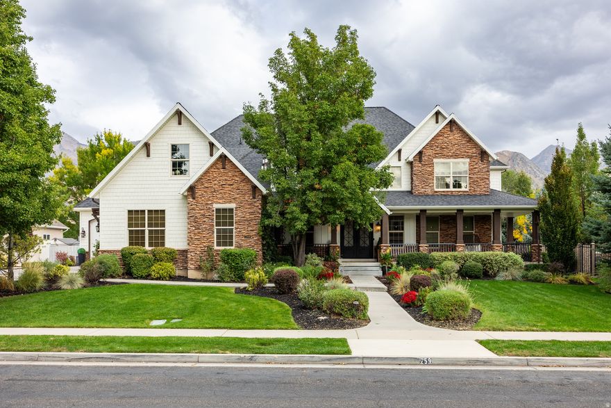 Price reduced! Call today for a private showing! Just steps away from parks and schools, this exquisite Alpine estate blends timeless craftsmanship with modern sophistication. Set against a backdrop of stunning mountain views, this home captivates with its stone and shake exterior, mature trees, and pristine landscaping. Inside, soaring ceilings, expansive windows, and warm finishes fill the home with light and character. The spacious white kitchen features an oversized Wolf gas stovetop, double ovens, quartz countertops and generous workspace-perfect for everyday living and entertaining. A large main-floor office provides the ideal work-from-home setup. The main-floor primary suite is a true retreat with a cozy fireplace, jetted tub, modern shower with multiple shower heads, heated towel rack, bidet toilet, and a large walk-in closet. Upstairs offers a family room and four spacious bedrooms (one currently used as a gym), each with beautiful mountain views. The walkout basement includes a large family/game room, plus a gorgeous 2-bedroom apartment (ADU) with wonderful month-to-month renters who would love to stay, providing a great opportunity for rental income or multi-generational living. A separate flex space with a kitchenette and bathroom is perfect for a home theater, studio, or playroom. Additional highlights include a 4-car garage, abundant storage, generator, and radon mitigation system. The fully fenced, flat backyard offers stunning views, a lovely garden, and inviting deck-ideal for gatherings and peaceful evenings. This exceptional Alpine home truly has it all!