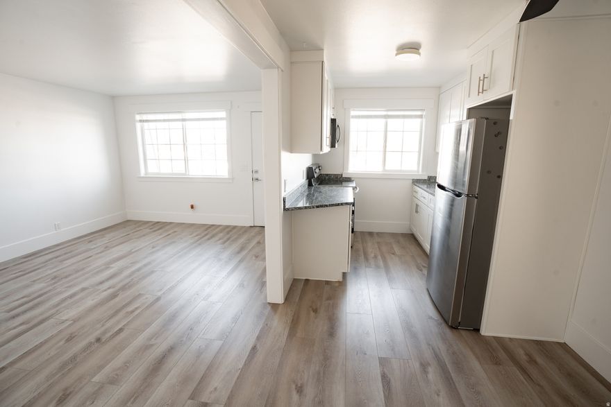 This amazing remodeled condo is move-in ready! It features new modern cabinets, granite countertops, new floors, stainless steel appliances, and In Unit Laundry!! The community offers low maintenance living with a picnic area, landscaping, and snow removal.