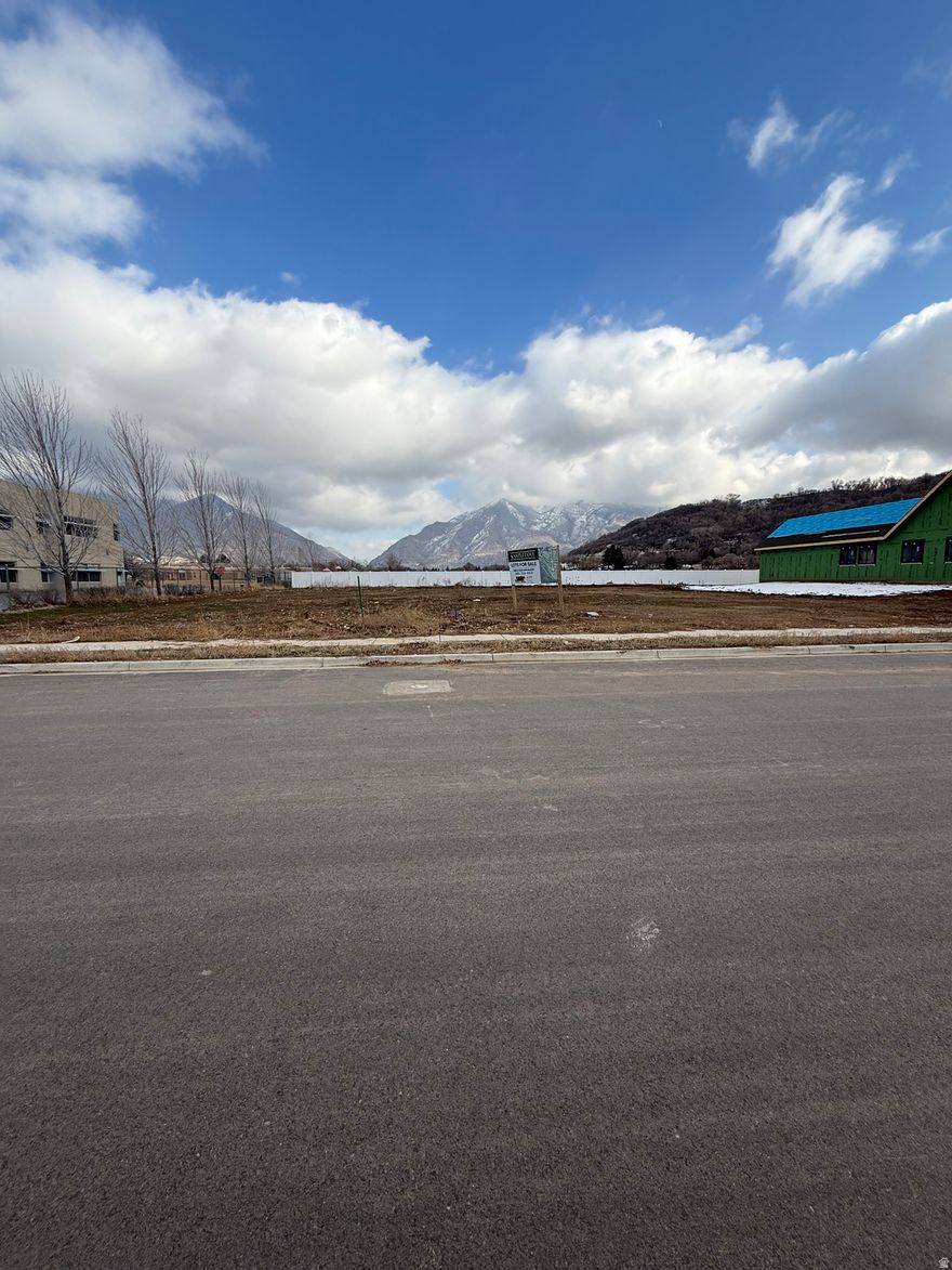 Rare opportunity to build in a highly desirable South Weber neighborhood! This spacious half-acre lot is ideally located next to an elementary school and surrounded by well-kept homes. Enjoy a family friendly setting with beautiful mountain views and convenient access to parks, schools, and major commuting routes. Lots like this don't come up often- bring your builder and your vision!