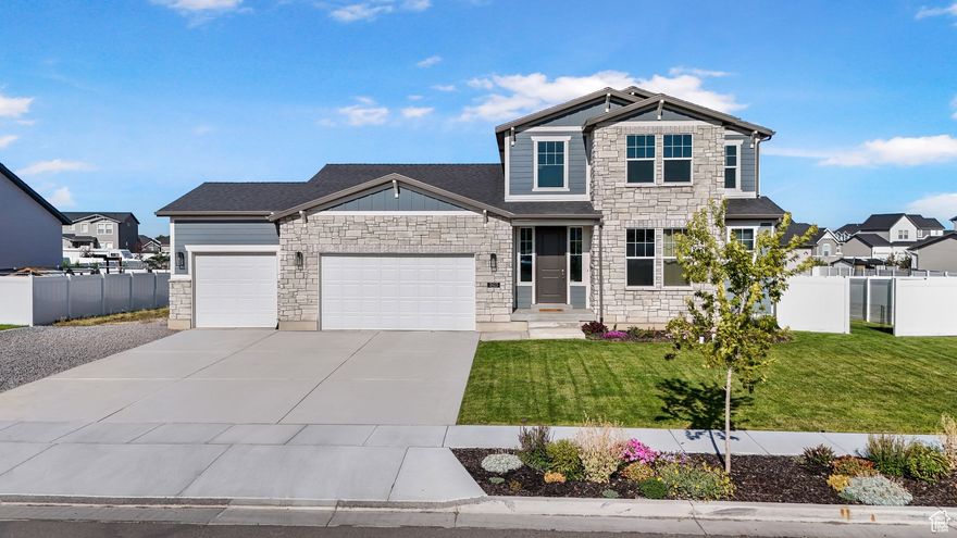 PRICE ADJUSTMENT!  Just built in 2023, this home offers modern comfort, timeless style, and thoughtful upgrades throughout. This spacious two-story home boasts 4,027 total square feet, with 2,495 finished, and room to grow in the unfinished basement that can easily be transformed into up to 3 additional bedrooms, a large family room, and storage. Inside, the main-level primary suite offers convenience and luxury with a spa-like bathroom featuring a separate soaking tub and shower with cultured marble surrounds, plus a generous walk-in closet. The open-concept layout is ideal for entertaining, with a chef's kitchen showcasing upgraded quartz countertops, premium maple cabinetry, stainless steel appliances, beautiful subway tile backsplash and a large island that flows seamlessly into the great room with a gas log fireplace. Upstairs, you'll find a full bath and three additional bedrooms, each with walk-in closets. This home has upgrades throughout, such as: Designer lighting and upgraded fixtures, Premium flooring and cabinetry, Enhanced exterior details including stone accents and premium siding, 2 tone paint, a mudroom off the garage, main-level laundry, and a covered front porch perfect for relaxing evenings. Outside, the yard is already landscaped, fenced, and ready to enjoy. A huge value compared to new construction! Conveniently located in Clinton, this home combines upscale finishes, smart design, and move-in ready upgrades you won't find in a brand-new build.