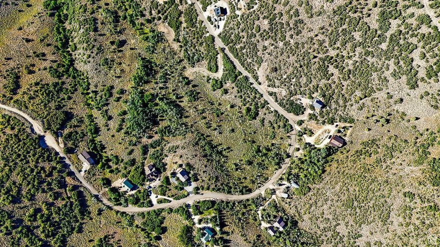 Discover 4.29 acres of one-of-a-kind alpine terrain in the sought-after Timber Lakes gated community. This rare, west-facing parcel offers an unparalleled blend of views, privacy, natural beauty, and year-round recreational access, making it the perfect location for your dream mountain retreat.  Framed by the soothing rustle of aspens and breathtaking Wasatch Mountain views, the property provides multiple potential build sites to capture stunning sunsets and star-filled night skies. Timber Lakes is renowned for its four-season lifestyle, offering nearby access to miles of private trails for hiking, mountain biking, snowshoeing, and cross-country skiing. In winter, explore snowmobile routes that connect to the extensive Uinta National Forest trail system. In summer, enjoy fishing in stocked lakes, paddleboarding, and wildlife watching right from your backyard.  Just minutes from Heber City's shops, dining, and golf courses-and a short drive to world-class skiing in Park City-this property offers the perfect balance between seclusion and convenience. Whether you envision a cozy cabin getaway or a grand lodge for family gatherings, this lot provides the space and setting to bring your vision to life.  Experience the ultimate mountain lifestyle - where adventure begins at your doorstep!  Lot lines in listing photos are provided as a courtesy and are not exact, please obtain your own measurements.