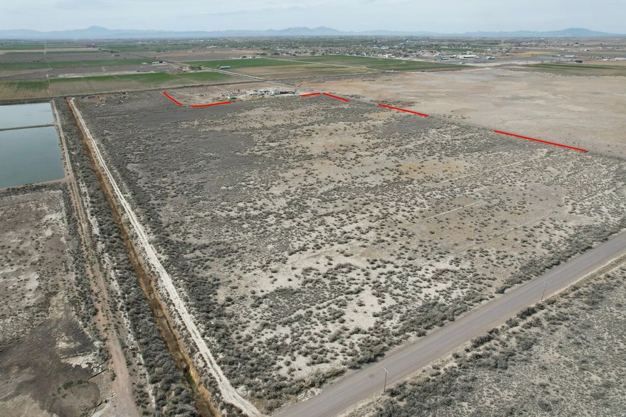 65 acres of vacant land outside the Delta city limits with AG-1 zoning. This property provides wide-open space and great access while still being close to town amenities. The Delta area is seeing significant industrial growth, including new data center developments planned near Delta. Address is approximate. Buyer to verify all information.