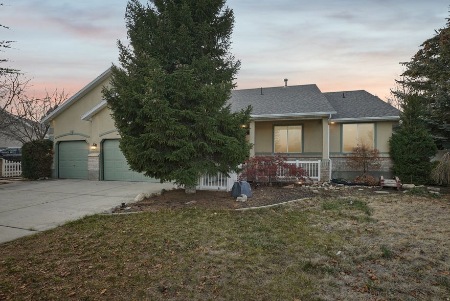 GRAND OPENING | OPEN HOUSE | DECEMBER 20 | 11AM-2PM | Rambler-style home in South Jordan with the potential for single-level living! This home features vaulted ceilings and fresh new carpet on the main level. The living area is highlighted by warm cherrywood floors, a cozy fireplace, and a large office perfect for working from home. The kitchen is beautifully appointed with granite countertops, stainless steel appliances, and a gas stove.  The spacious primary suite includes a walk-in closet and an ensuite bathroom with a garden tub and separate shower. Downstairs you'll find another fireplace, providing a comfortable retreat for gatherings and relaxation.  Additional highlights include a three-car garage with storage racks, a private deck, and mature landscaping that creates a sense of privacy and seclusion. This home combines comfort, functionality, and timeless appeal-schedule your showing today!