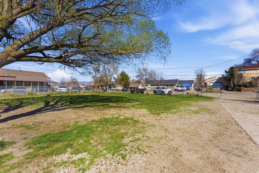 This is one of a kind! Must See this home with 5 bedrooms and 3 baths - .77 acre; zoned for animals! Freshly painted throughout. New light fixtures, vinyl wood and tile flooring. Two car garage plus sheds and out buildings. Fenced for all kinds of animals. Horses can be ridden on the road. Large dog run. Workshop. Ideal for chickens, goats and horses. Two horse stalls and a tack room. Home has a mother-in-law apartment with its own kitchen, bedroom, bath and laundry. $599,900 for the home and .50 acre; $160,00- for .27 acre on the northside or both for $750,000. A home and horse property like this is hard to find!!