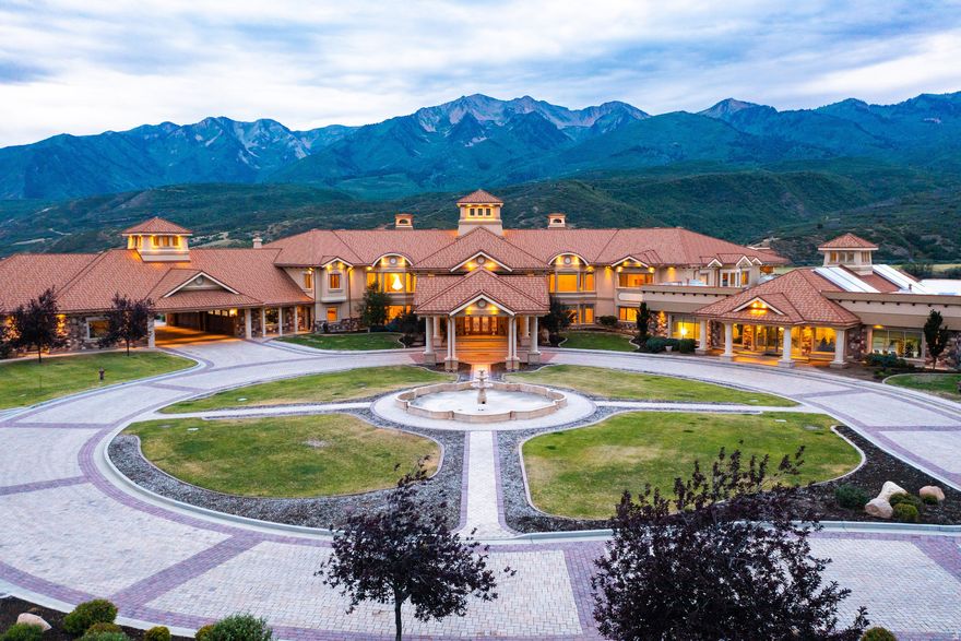 MASSIVE PRICE REDUCTION! Don't wait any longer. This is your chance to get the best deal in Utah. Located at the end of Hobble Creek Canyon, this expansive estate is one of the largest private residences in the country. Covering 50,738 square feet on 150 acres, it offers complete privacy and sweeping views of Utah's Wasatch Mountains. The grand entryway features 20-foot ceilings, a statement chandelier, and dual staircases leading to the main living spaces. Floor-to-ceiling windows in the formal living room highlight the surrounding mountains. The home includes a spacious master suite and five well-appointed guest suites, all designed with high-end finishes. The estate is built for both luxury and recreation. A massive indoor pool complex includes a waterslide, waterfall, lazy river, rope swing, hot tub, and a children's area, along with an outdoor kitchen. Additional amenities include a basketball court, two-lane bowling alley, a 27-seat theater, sauna, fitness center, game room, and a dedicated children's playroom. A designated area for a private shooting range is also on the property. The 156 acres offer opportunities for horseback riding, with space for stables and trails. Outdoor activities include golfing at a nearby top-rated course, hiking, mountain biking, ATV riding, hunting, snowmobiling, and cross-country skiing. While secluded, the property remains accessible-just 35 minutes from a private airport and about an hour from Salt Lake City. Whether used as a primary home, vacation retreat, or corporate getaway, this estate is a rare opportunity to own one of the most amazing properties in Utah.