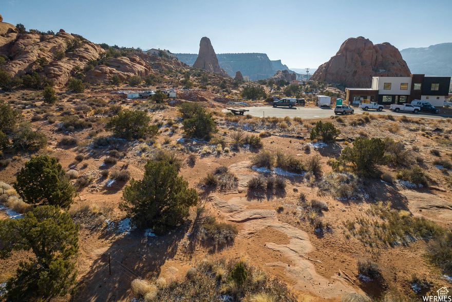 Prime .45-acre lot in an upscale Moab neighborhood, ready for your dream home! Includes paid Grand Water and Sewer impact fees, a professional survey, and available architectural plans. Enjoy a seamless start to building in this sought-after community.