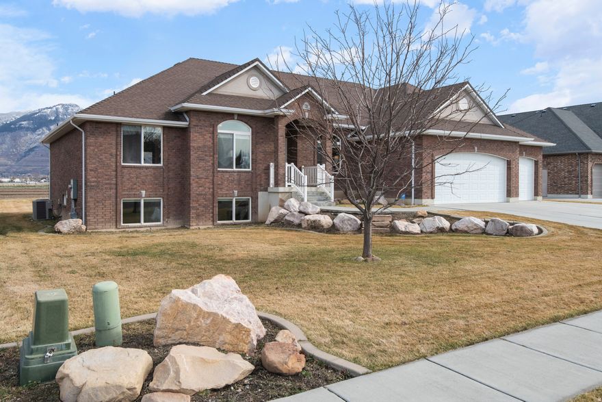 BRING US AN OFFER!  Welcome to your new home in Farr West, Utah - where open skies, peaceful surroundings, and expansive mountain views set the tone for everyday living. With no backyard neighbors, you'll enjoy added privacy and the quiet beauty Northern Utah is known for. This spacious 7-bedroom, 4-bathroom home offers flexible living with generous spaces for gathering, working, or hosting guests. Washer and dryer hookups on both levels make multi-generational living easy, while the fully finished basement with wet bar provides a great space for entertaining or the potential for a future accessory dwelling. Step outside to take in sweeping mountain views, colorful sunsets, and serene evenings in your private backyard. Located in a quiet neighborhood with convenient access to local amenities, this home offers room to grow, Utah lifestyle appeal, and income potential all in one.