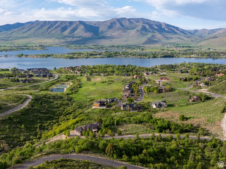 If you're seeking the perfect location to build your dream mountain retreat, this premier lot in the gated Hawkins Creek community offers it all. With stunning views of Pineview Reservoir, Ogden Valley, and the peaks of Powder Mountain, Ben Lomond, and Lewis, this lot provides endless design possibilities. The geo study has already been completed, saving time and expense, and the lot borders open space, ensuring additional privacy and tranquility. Positioned just off the historic Old Snowbasin Road, the property is minutes from Snowbasin Resort, Anderson Cove's boat dock, and miles of trails for hiking, biking, and skiing. Surrounded by alpine meadows, oak forests, and preserved open spaces, Hawkins Creek prioritizes harmony with nature, with covenants to protect migratory wildlife and Architectural Guidelines to maintain the landscape's beauty. The Legends subdivision features 160 acres of rolling hills, nearly 80 acres of open space, and a private trail system for hiking, biking, and equestrian activities, with additional public trails nearby. This lot offers the ultimate blend of privacy, adventure, and convenience, making it the ideal canvas for your mountain hideaway. *All property information, boundaries, and documents to be verified by buyer.