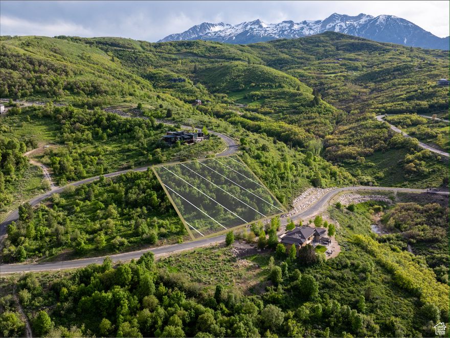 If you're seeking the perfect location to build your dream mountain retreat, this premier lot in the gated Hawkins Creek community offers it all. With stunning views of Pineview Reservoir, Ogden Valley, and the peaks of Powder Mountain, Ben Lomond, and Lewis, this lot provides endless design possibilities. The geo study has already been completed, saving time and expense, and the lot borders open space, ensuring additional privacy and tranquility. Positioned just off the historic Old Snowbasin Road, the property is minutes from Snowbasin Resort, Anderson Cove's boat dock, and miles of trails for hiking, biking, and skiing. Surrounded by alpine meadows, oak forests, and preserved open spaces, Hawkins Creek prioritizes harmony with nature, with covenants to protect migratory wildlife and Architectural Guidelines to maintain the landscape's beauty. The Legends subdivision features 160 acres of rolling hills, nearly 80 acres of open space, and a private trail system for hiking, biking, and equestrian activities, with additional public trails nearby. This lot offers the ultimate blend of privacy, adventure, and convenience, making it the ideal canvas for your mountain hideaway. *All property information, boundaries, and documents to be verified by buyer.