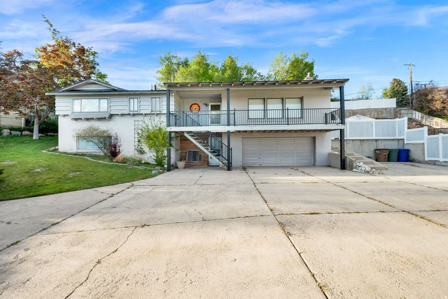 An iconic Avenues residence featuring truly unmatched mountain and valley views. This rarely available home sits high in the Avenues, offering a prime location paired with exceptional privacy.  Set on an expansive 0.35-acre lot-an uncommon find in the Avenues-the property boasts a park-like backyard with wide-open space perfect for relaxing or entertaining. The expansive covered front deck captures breathtaking, unobstructed views of both the valley and surrounding mountains, creating a stunning backdrop year-round. New paint and carpet. Main level has 3 bedrooms. Two were combined to create a larger primary, but the layout can easily function as either one large suite or three separate bedrooms.  The secluded lot provides abundant parking, including dedicated RV space and additional off-street options-another rare feature for the area.  Ideally located just minutes from downtown Salt Lake City, you'll enjoy convenient access to City Creek Canyon, Memory Grove, shopping, dining, and the vibrant Avenues lifestyle. Major hospitals, universities, and freeway access are all close by, with the airport just a short drive away.  Outdoor enthusiasts will love the proximity to endless hiking and biking trails, along with quick access to world-class ski resorts.  A rare opportunity to own a one-of-a-kind property in one of Salt Lake City's most sought-after neighborhoods. Buyer to verify all information. Information deemed reliable but not guaranteed.  Buyer to verify ALL information provided, listed on the MLS and marketing information... information is not guaranteed.   Square footage figures are provided as a courtesy estimate only and were obtained from Tax Data.  Buyer is advised to obtain an independent measurement.