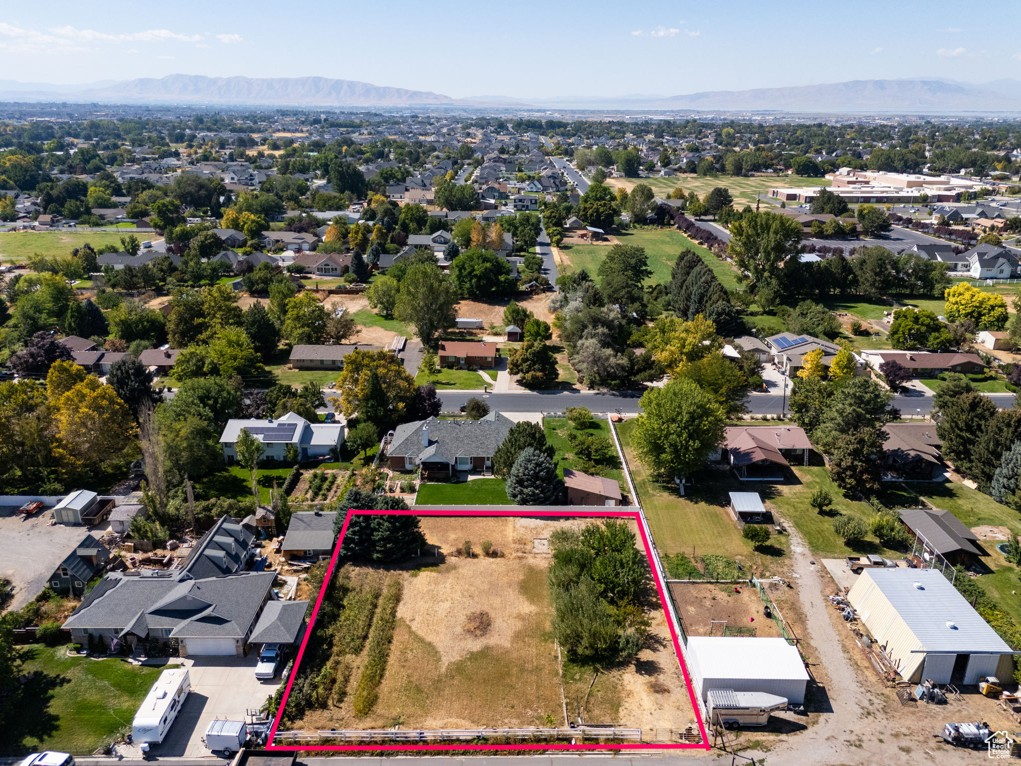 Beautiful 0.44-acre lot in the heart of Mapleton! This fully fenced property features a small orchard with 8 mature fruit trees (2 apricot, 1 peach, 1 Asian pear, and 4 apple), plus grapes, raspberries, and blackberries. House plans are available for a stunning 5,400 sq. ft. residence, including a 1,200 sq. ft. basement apartment with a private exterior entrance-or bring your own vision and build the home of your dreams! Just a 5-minute drive to Wayne Bartholomew Family Park and US-89, with convenient access to shopping, dining, entertainment, and more. Measurements provided as a courtesy only, buyer to verify all info.
