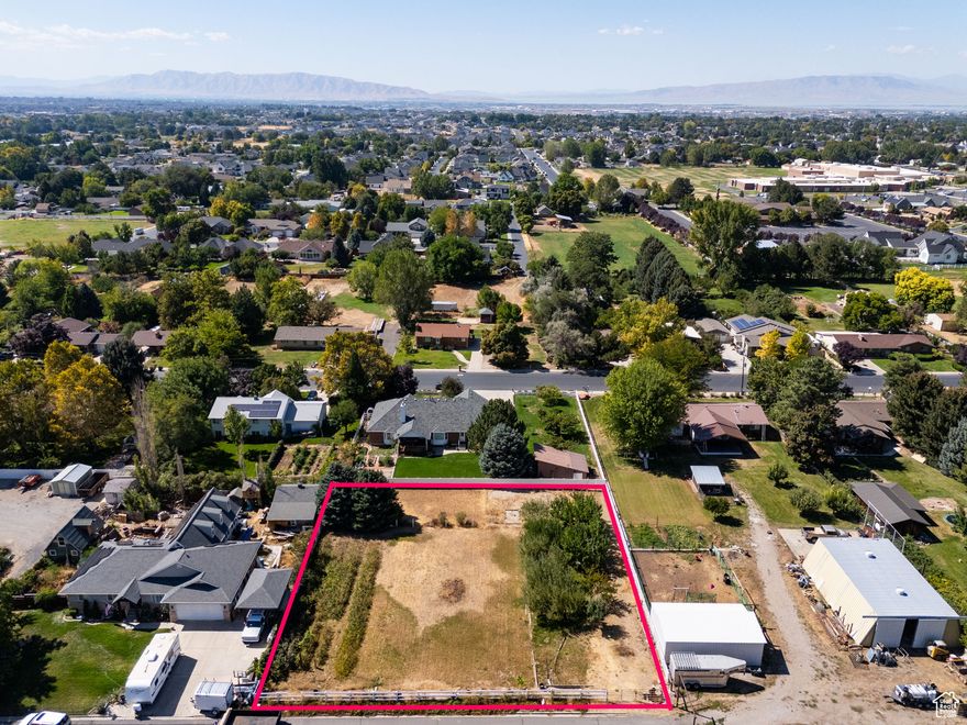 Beautiful 0.44-acre lot in the heart of Mapleton! This fully fenced property features a small orchard with 8 mature fruit trees (2 apricot, 1 peach, 1 Asian pear, and 4 apple), plus grapes, raspberries, and blackberries. House plans are available for a stunning 5,400 sq. ft. residence, including a 1,200 sq. ft. basement apartment with a private exterior entrance-or bring your own vision and build the home of your dreams! Just a 5-minute drive to Wayne Bartholomew Family Park and US-89, with convenient access to shopping, dining, entertainment, and more. Measurements provided as a courtesy only, buyer to verify all info.