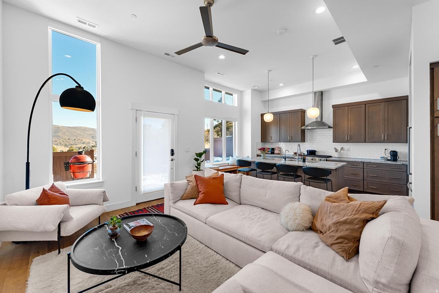 This is what you've been waiting for~ Come home from a hike or a day on the nearby bike trails while overlooking ALL of the mountain and Woodward Ski and Bike Resort views right from your backyard patio! Fenced in space for you, family, friends, and your pets to relax and watch the sunrise or the beautiful colorful sky turn as the sun sets. Vaulted ceilings with excellent natural light from the east into the great room and primary bedroom/bath. Upgraded wood floors throughout,  granite and quartz countertops, gas range, cozy up and set the mood after a long ski day, full-home smart* controlled lighting and window shades, RO water system, 220 electric car outlet, extra under stairwell storage space with room in the garage to build in more. Built-ins have been added to the kitchen and guest room for added comfort. The community of Discovery Ridge is vibrant with sidewalk paths, a grass dog park, manicured mountain bike paths and hiking trails that all back up to the 1000+ acre Toll Canyon. Discovery Ridge is located in the Park City School District. Park City Mountain Resort and Canyons Resort are only minutes away, with SLC International and SLC downtown just a 25 minute drive. Don't miss out on this wonderful opportunity with extraordinary VIEWS VIEWS VIEWS, schedule your showing today.