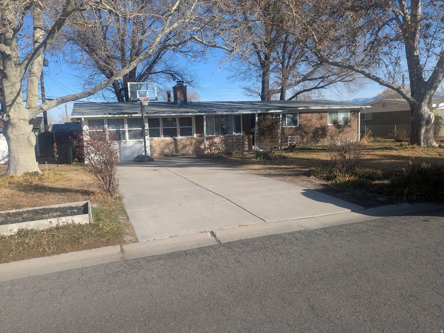 Come see this lovely rambler on a quiet street in West Valley City! This house boasts many updates including the kitchen and bathrooms. It has three bedrooms, with a family room that can be used as a fourth bedroom, and two baths. The roof was re-surfaced in 2025 and the central air conditioner was installed in 2024. There is a workshop out back for projects as well.  The level yard is framed with mature shade trees and is lined with many flowers in the Spring and Summer. Please call the owner/agent for showings. Square footage figures are provided as a courtesy estimate only and were obtained from public records .  Buyer is advised to obtain an independent measurement. Owner is a licensed real estate agent in Utah #14190747-SA00