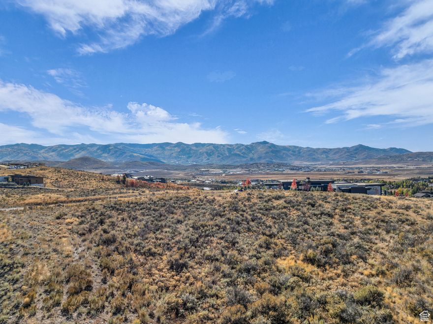 GOLF MEMBERSHIP AVAILABLE. Situated in Promontory's, Elk Ridge Bluffs neighborhood, this 1.62 acre flat lot offers panoramic ski resort views & a large building envelope. Centrally located to the club amenities including the Hills golf course and Sage Restaurant, the Pete Dye golf course & club house, the Village facilities including pool, spa, gym, tennis, pickle ball, multiple restaurants, ice skating, kids cabin, and the Shed, which contains an indoor basketball court, bowling lanes, and a theater. Additional amenities include the Jack Nicklaus golf course, the Double Deer club house & Peak restaurant, the beach club, tubing hill, bocci ball, cross county skiing, soccer field, fishing pond, equestrian center, and the alpine lodges at Deer Valley & Park City mountains.