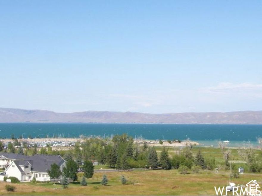 Incredible view lot overlooking beautiful Bear Lake! Located in Lochwood Subdivision across from the Bear Lake State Park Marina.  Paved roads, close to bike path, shops and restaurants.  Lochwood amenities included Swimming pool and Playground!  Short-term rentals allowed!  Build your dream home and come play at the lake!