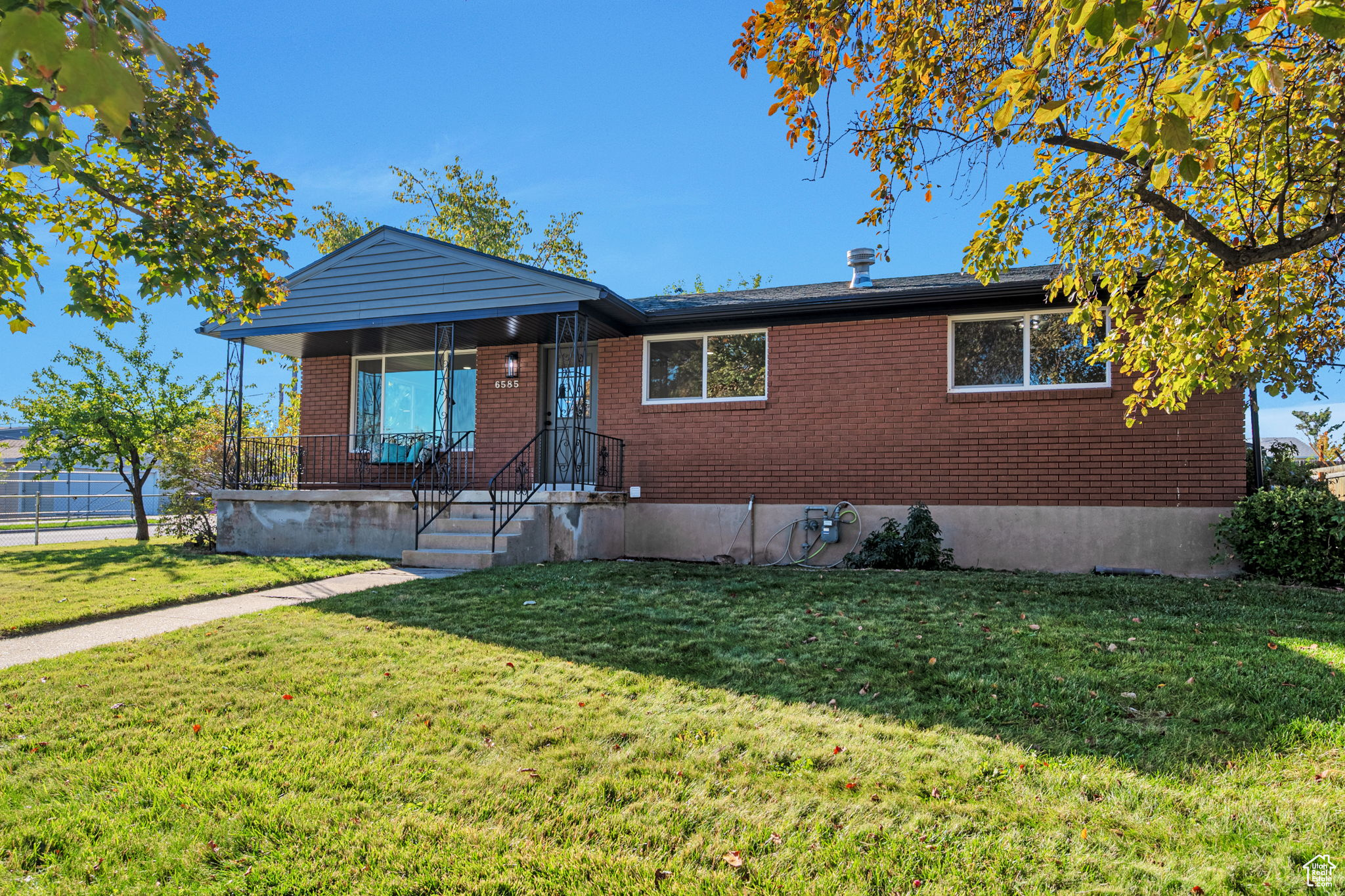 Welcome to your dream home! This fully renovated property combines modern style with everyday comfort. Step inside to find brand-new double-pane vinyl windows, a custom designer kitchen with quartz countertops, new stainless steel appliances, and a huge island that's perfect for family meals, entertaining guests, or just enjoying your morning coffee. The open layout makes this home feel bright and spacious, while thoughtful updates give it a truly move-in-ready feel. Outside, you'll love the fully covered patio-ideal for summer barbecues and gatherings in the shade. The yard is stunning, featuring mature trees and a well-maintained landscape that adds both charm and privacy. A detached, extra-wide garage provides plenty of space for vehicles, tools, and storage. And the location can't be beat-you're just minutes from Mountain View Corridor, with shopping, dining, and amenities all close by. This home has it all: style, comfort, and convenience. Come see it today-before it's gone!